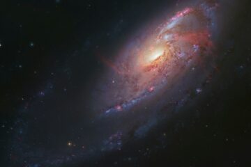 a very large and colorful spiral shaped object in the sky