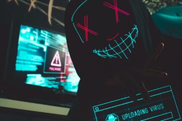 Man in Black Hoodie Wearing Black and White Star Wars Cap