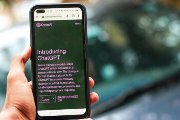 Webpage of ChatGPT, a prototype AI chatbot, is seen on the website of OpenAI, on a smartphone. Examples, capabilities, and limitations are shown.