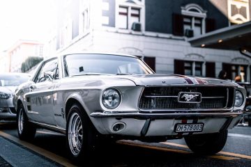 black mercedes benz coupe parked on parking lot during daytime