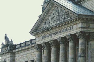 Exterior of a historic German courthouse showcasing classical architecture with ornate columns.