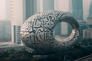 a large white sculpture in the middle of a city