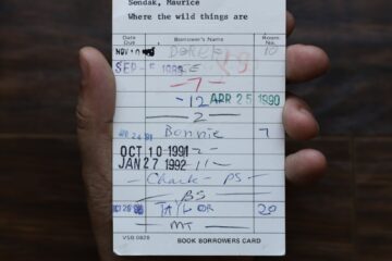 person holding white paper document