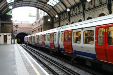 blue and white train on train station during daytime