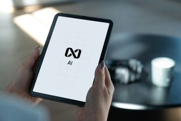 Hands holding a tablet displaying ai logo