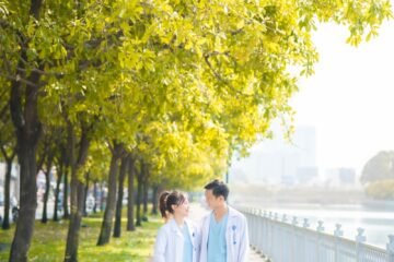 a couple of people that are walking down a sidewalk