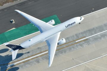 a large passenger jet flying over a runway
