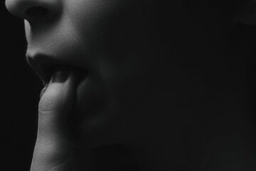 woman biting finger illustration