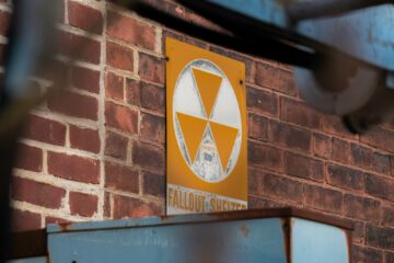 a sign on the side of a brick building