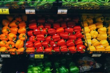 pile of bell peppers and beans at the grocery