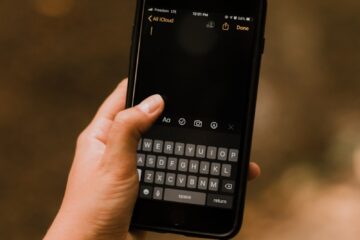 person holding black android smartphone