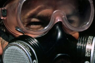 a close up of a person holding a camera