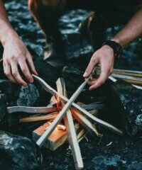 person holding gray wooden wood