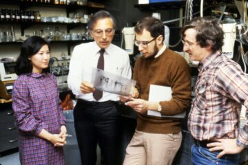 three men standing beside woman