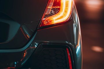 black car with red and yellow lights